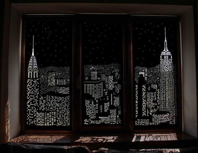 The HoleRoll Is A Perforated Blind That Shows A Cityscape