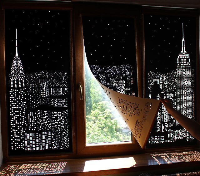 The HoleRoll Is A Perforated Blind That Shows A Cityscape