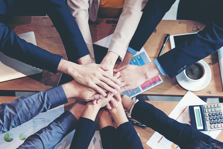 Teamwork Success. Top view executive business people group team happy showing teamwork and joining hands after meeting partner business in office. Business Concept.