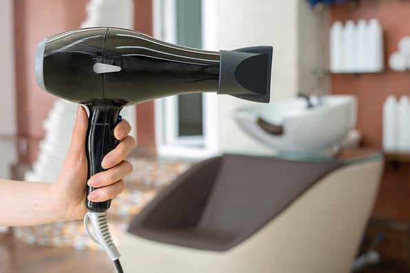 Best Ways To Use A Hair Dryer Diffuser Hair dryer professional hair dresser tool in hairdressers hand against beauty salon interior background. Hair stylist work space. Beauty hairdressing salon, Barber shop, beauty services for hair
