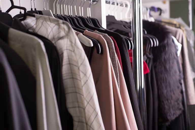 clothes hanger atelier designer clothes shop. close-up of diverse womens clothing