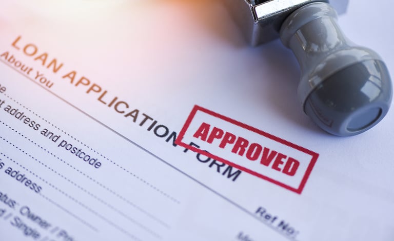 Loan approval / financial loan application form for lender and borrower for help investment bank estate concept money