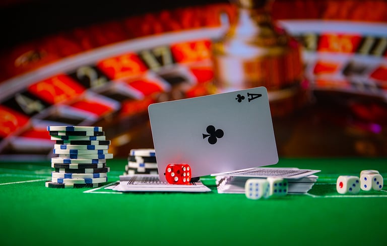 Cards and chips on green felt casino table. Abstract background with copy space. Gambling, poker, casino and cards games theme. Casino elements on green. Selective focus