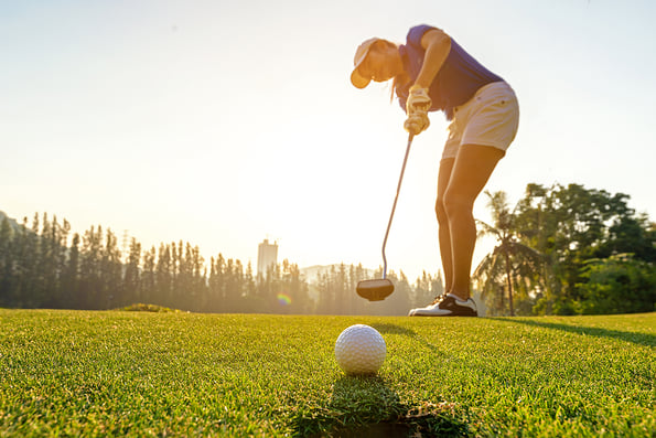 girl playing golf