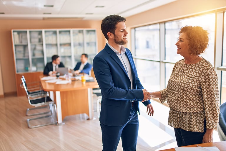 Business lawyers workers meeting at law firm office. Professional executive partners working on finance strategry at the workplace. Shaking hands for succesful agreement.