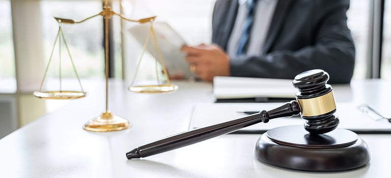 Judge gavel with Justice lawyers, Counselor in suit or lawyer working on a documents in courtroom, Legal law, advice and justice concept.