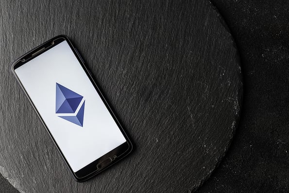 Logo of Ethereum blockchain money cryptocurrency on screen of smartphone.