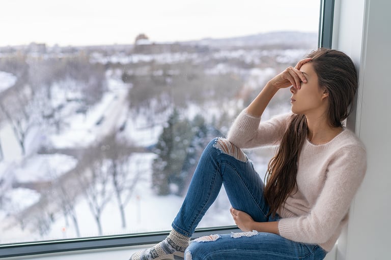 trauma mental health Seasonal affective disorder SAD depression winter season anxious alone young girl feeling lonely - stress, anxiety, melancholy emotion at home. Mental health problem.