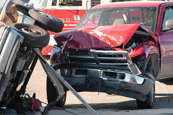 car accident two cars smashed together in a car accident with rollover