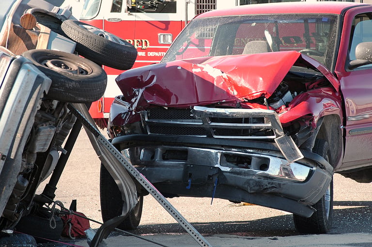 car accident two cars smashed together in a car accident with rollover