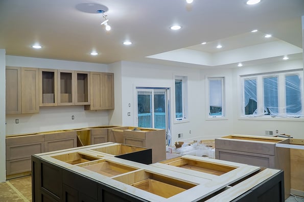 Interior design construction of kitchen remodel with cabinet maker installing home improvement custom