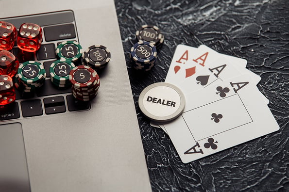 Chips, dices and playing cards for poker online or casino gambling. Online poker concept