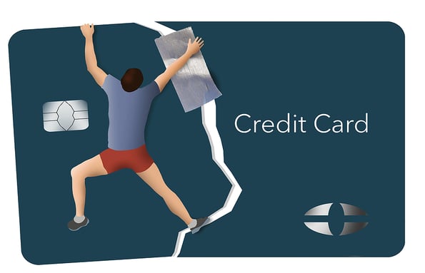 A man uses duct tape as he tries to repair his credit by taping together a broken credit card.