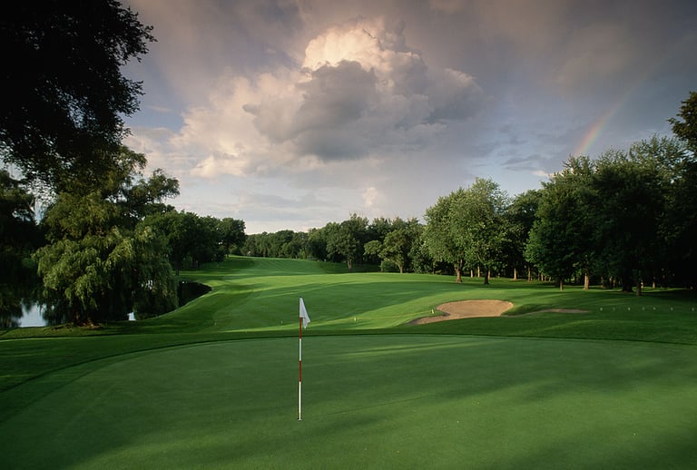 a fairway leads to a green on the golf course at the interlachen country club. edina, minnesota.