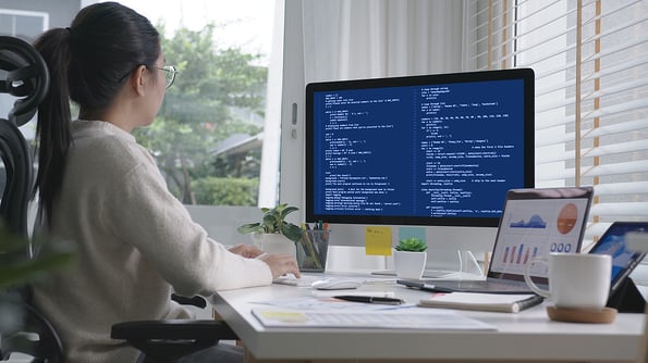 Back rear view of young asian woman, freelance data scientist work remotely at home coding programing on Big data mining, AI data engineering, IT Technician Works on Artificial Intelligence Project.
