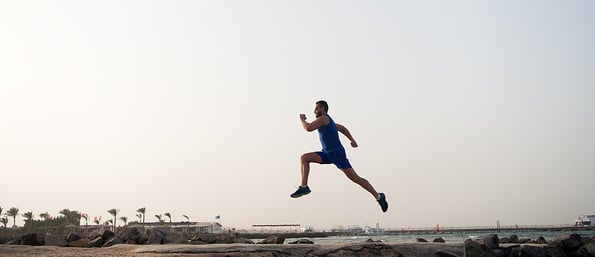 Run hard or walk home. Running man on beach. Runner training outdoors. Fit male sport fitness exercising in summer. Running sport and hobby. Daily workout great result. Man professional fitness coach.