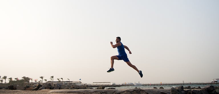 Run hard or walk home. Running man on beach. Runner training outdoors. Fit male sport fitness exercising in summer. Running sport and hobby. Daily workout great result. Man professional fitness coach.
