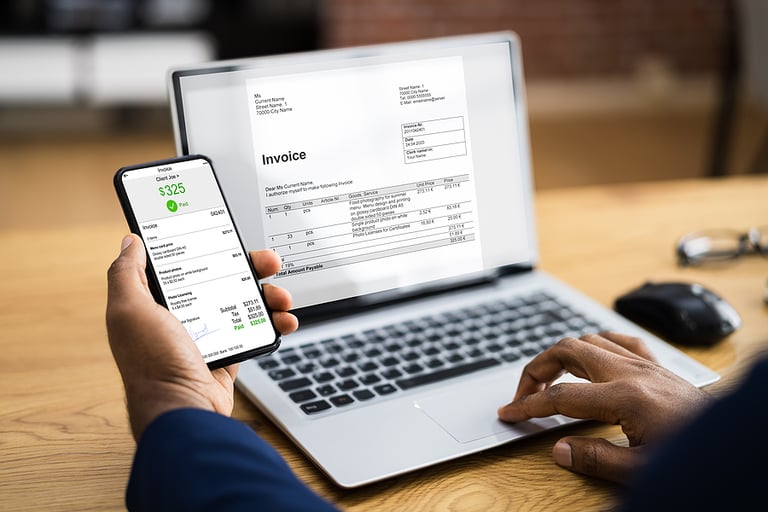 African American Using Accounting Invoice Budget App On Computer