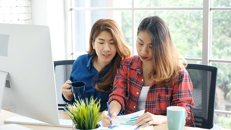 Asian women at home office, Happy two young asian women working with laptop computer at office, Asian friends working together with happiness, Asia girl working at home, online education