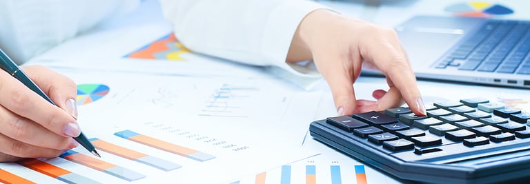 loan Finance and business concept. Female small business. Hand pointing at statistics chart. calculator on financial graphs on desk. Accounting budgeting loans or market analysis. finance office web banner