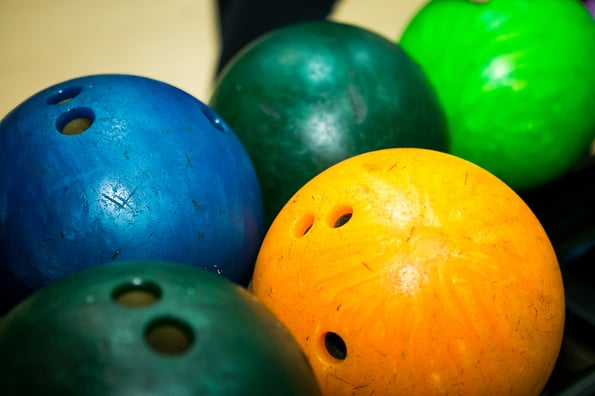 Bowling. Multicolored bowling balls on the shelf in the bowling club.