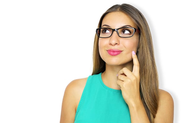 clear thought Studio portrait of beautiful young woman with glasses thinking and looking upwards against violet background. Thinking, reflecting concept. Copy space.