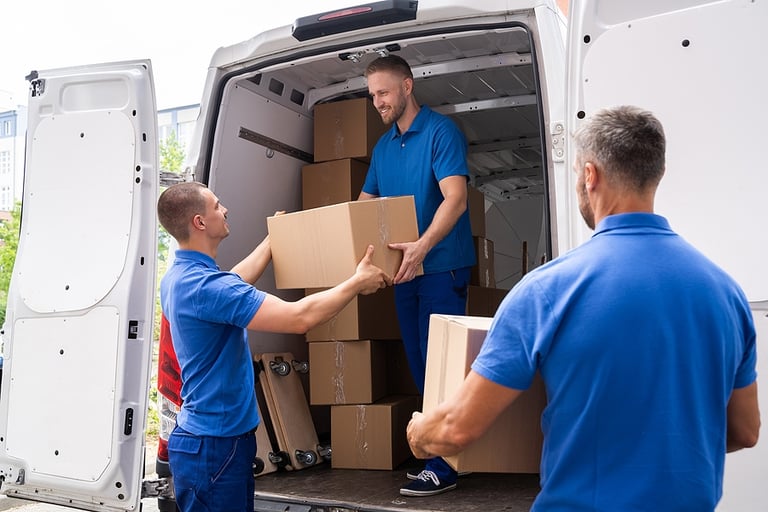 Truck Movers Loading Van Carrying Boxes And Moving House