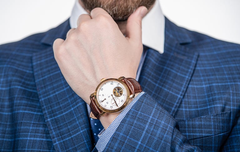 Class is timeless. Wristwatch worn on male arm wrist. Business wristwatch collection. Time management