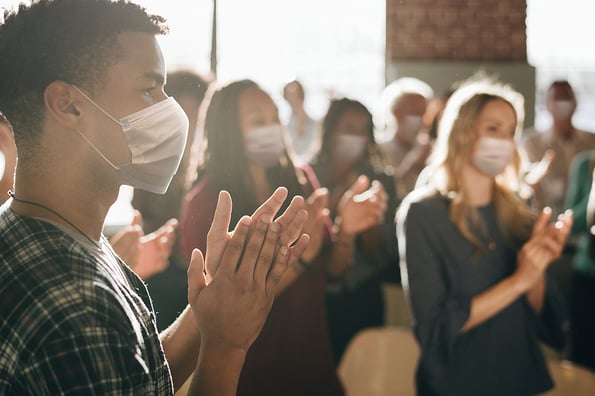 Business party in new normal with crowded people wearing masks
