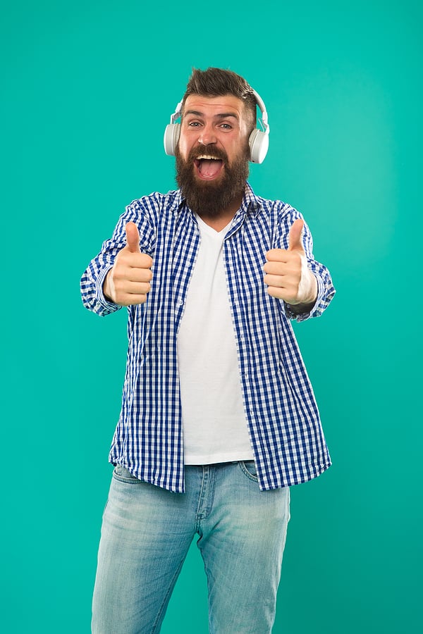 Excellent sound. Music library concept. Tech gadgets all music lovers should have. Music always with me. Man listening song in headphones. Best gifts for music lovers. Bearded hipster wear headphones.