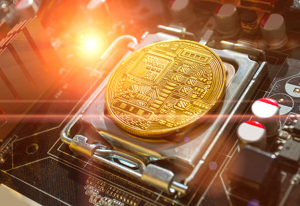 Bitcoin composition. Golden bitcoin among the electronic computer components, business concept of bitcoin digital cryptocurrency. Blockchain technology composition, bitcoin mining concept