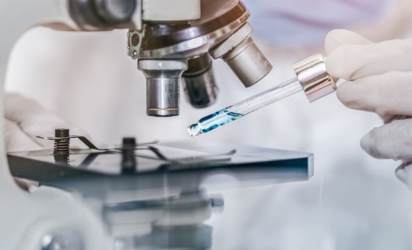 scientist with equipment and science experiments laboratory glassware containing chemical liquid. Health care researchers working in life science laboratory analyzing microscope slides in research lab