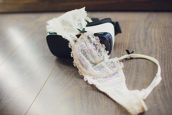 female, bra on a black sheet, virtual reality vr technology used for porn vr video in adult entertainment. home