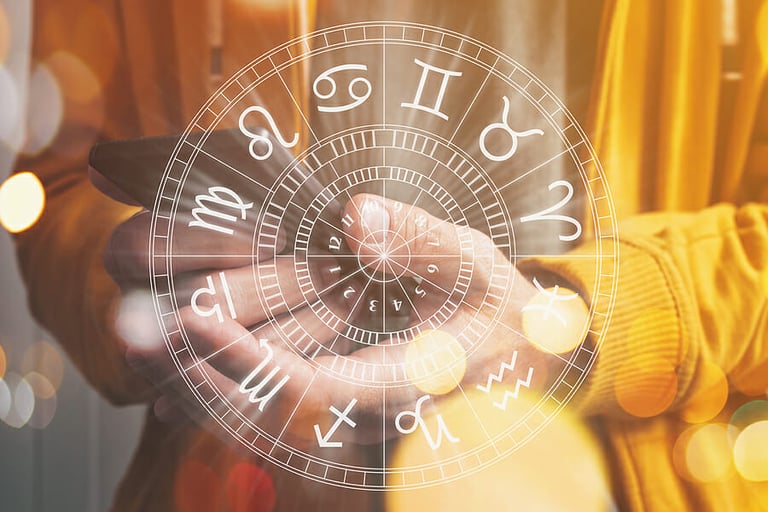 Astrology smartphone app concept, man using mobile smart phone, closeup of hands with astrological chart, selective focus