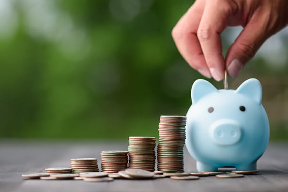 business finance and saving money investment , Money coin stack growing graph with hand putting coin on piggy bank saving concept. Balance savings and investment.