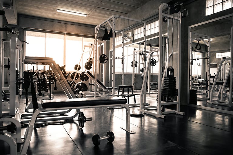 machine in gym with modern fitness equipment for fitness events and more. Modern of gym interior with equipment. Sports equipment in the gym.