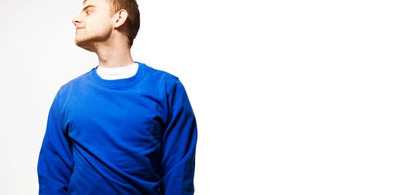 the guy hipster in the blue sweatshirt blank smiling on a white mock up