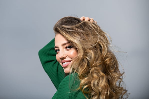 Woman smiling face for beauty salon. Portrait of pretty smiling girl with natural hair. Female face portrait. Healthy face skin, skincare cosmetology cosmetics.