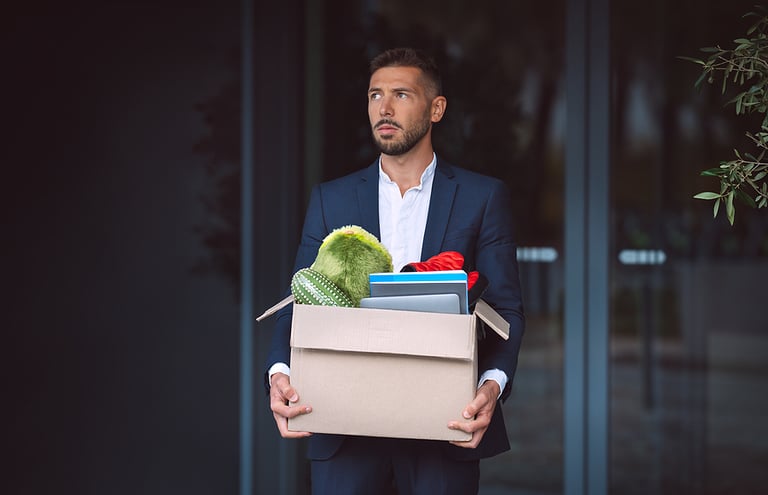 Upset man got fired from an office job. Office worker lost his job. Dismissal from work or job loss.