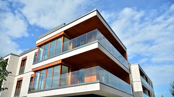 Estate property and condo architecture. Fragment of modern residential flat with apartment building exterior. Detail of new luxury home complex.