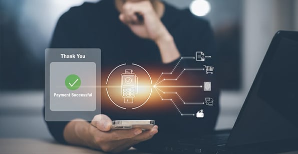 Man using smart mobile phone to pay online Concept, online payment mobile technology, smartphone touching pay button mobile banking application in Black background, banking and online shopping.
