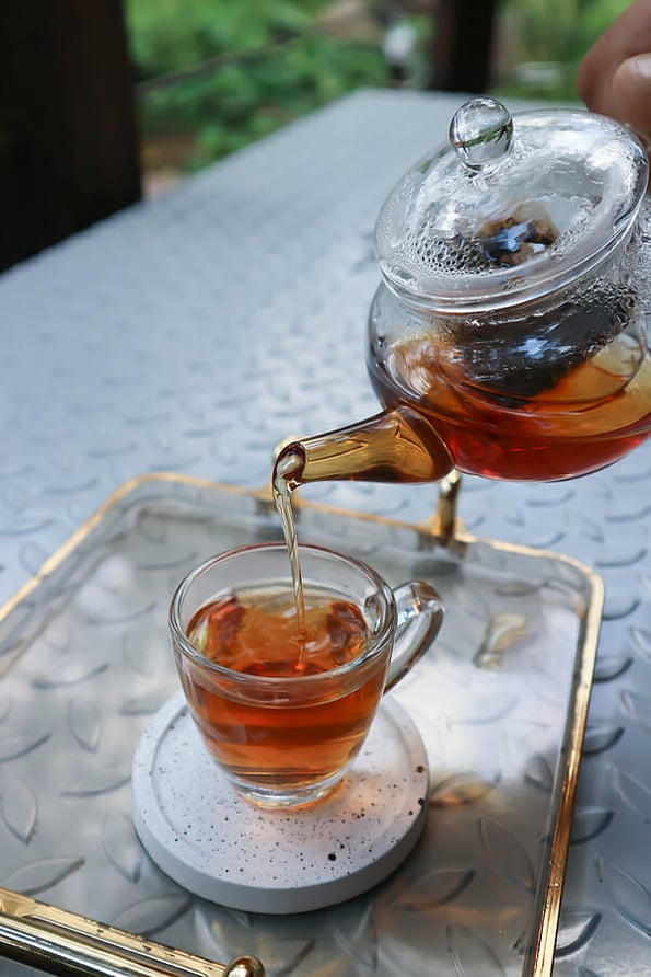 pouring tea , tea cup and tea pot for drink or English tea or Chinese tea