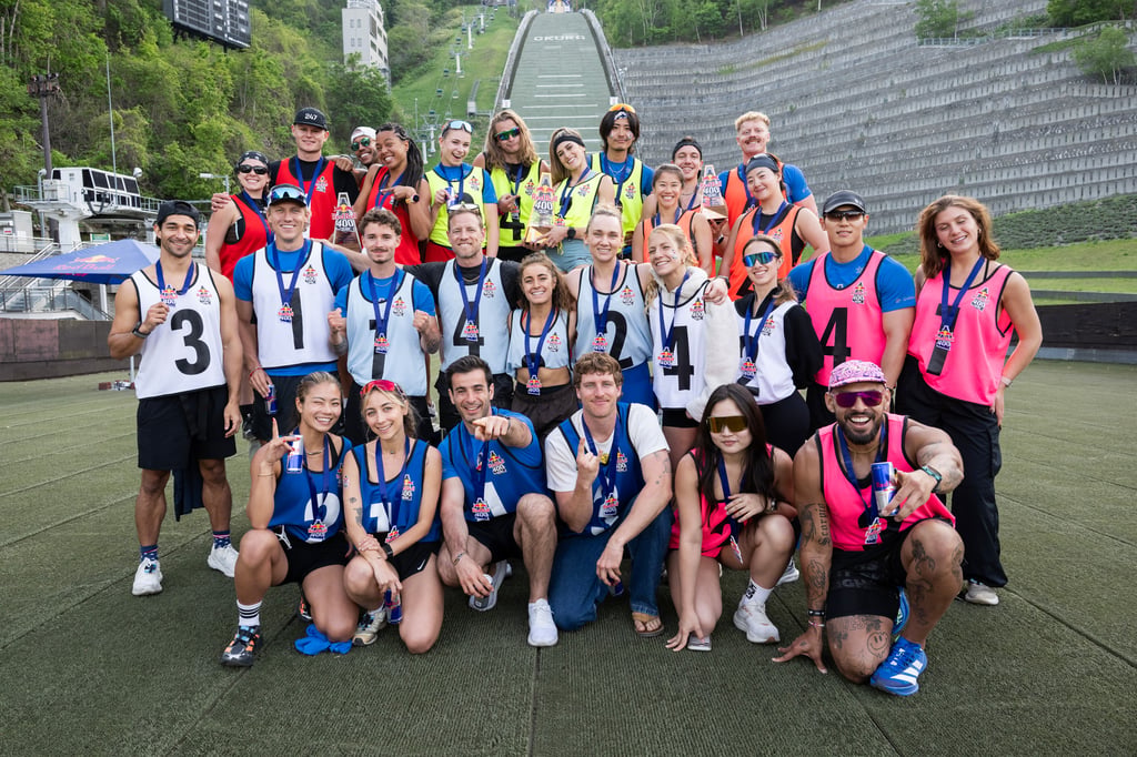 All event participants pose for a group photo at the Red Bull 400 Team Ascent at the Mt. Okura Ski Jump Stadium in Sapporo, Japan on March 15, 2026.