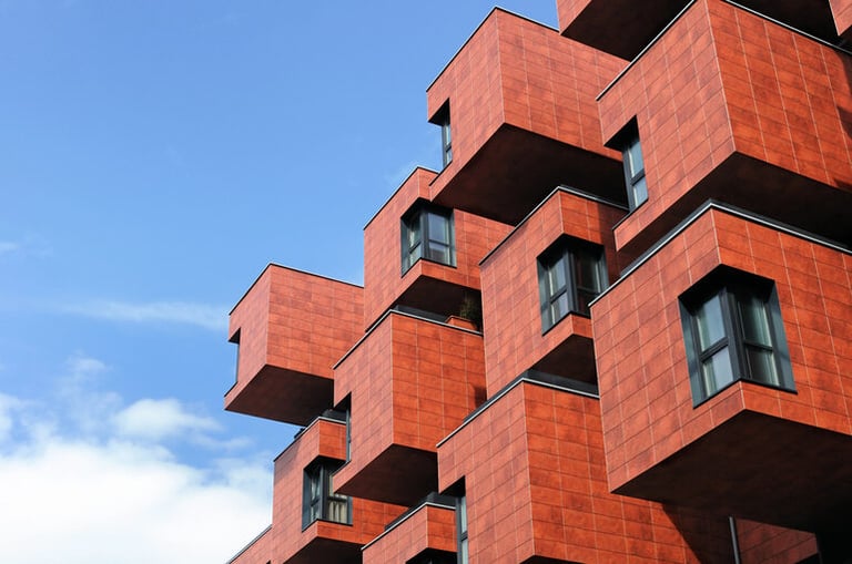 Modern building with giant block-like cantilevered sections showcasing modular architectural design.