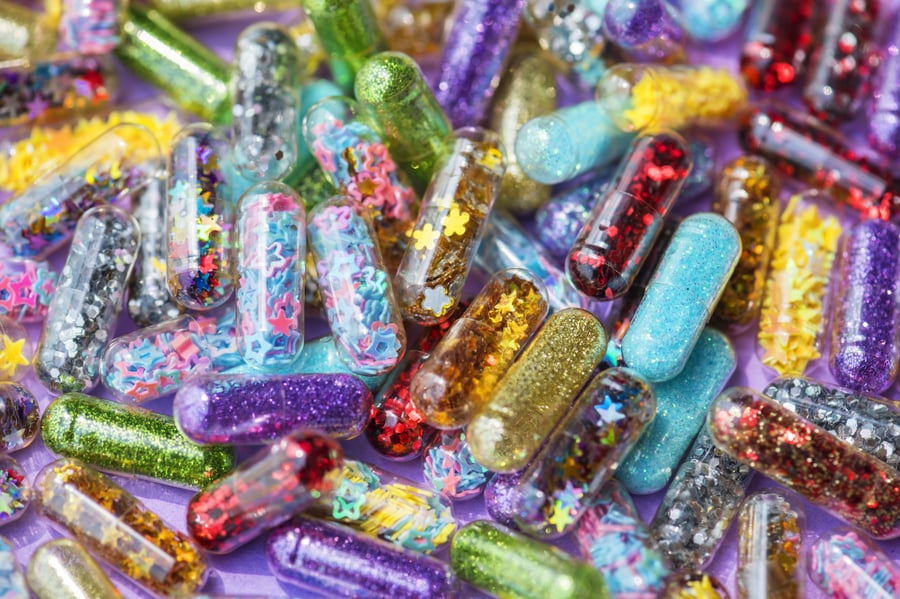 Colorful novelty glitter poop pills arranged together