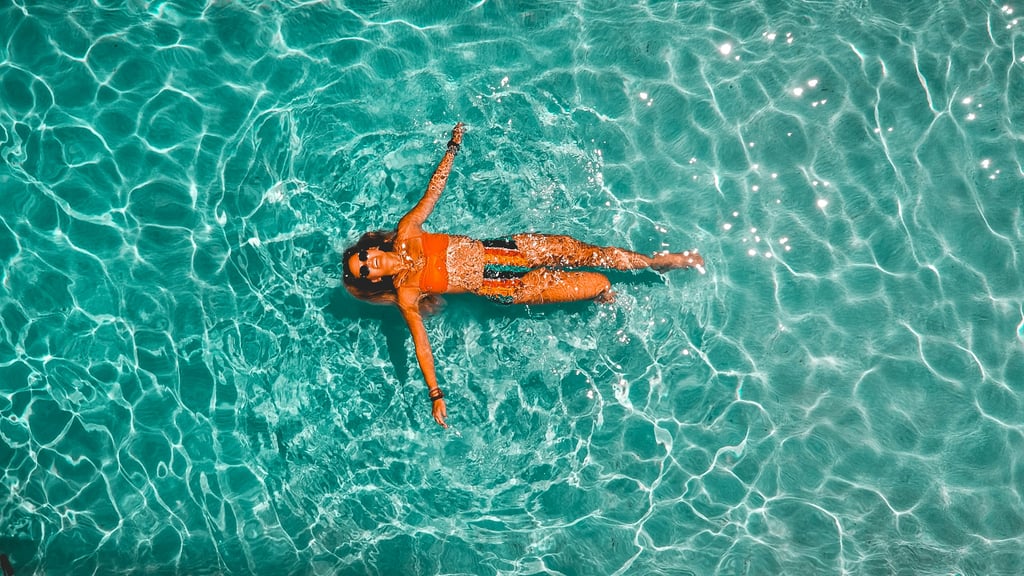 Top view of a woman swimming in a pool