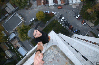 Guy Hanging Off The Edge Of Structures