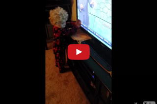 This Little Boy Can’t Stop Words From Scrolling On The TV