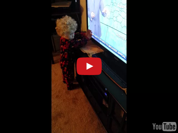 This Little Boy Can’t Stop Words From Scrolling On The TV