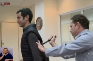 A Reporter Demonstrates An ALLEGED Stab-Proof Vest